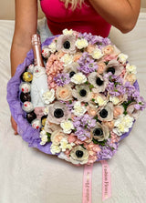 «Floral champagne» - box with sparkling wine, sweets and assorted flowers.