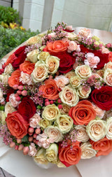 “Autumn shades”- roses, spray roses, spray carnations, wax flowers.