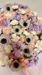 «Floral champagne» - box with sparkling wine, sweets and assorted flowers.