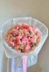 “Pink flamingo” - ranunculus and spray roses.