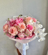 Blossoms of Blush Serenit - long step roses, orchid, hydrangeas and stock flowers.