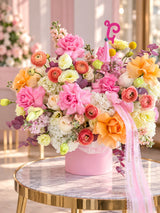 Large vibrant flower arrangement in pink box with pink and orange roses, ranunculus, hydrangea and Fashion Flowers ribbons - same-day delivery Aventura