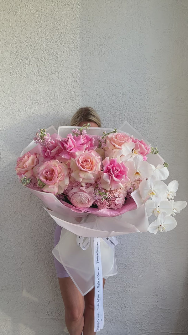 Blossoms of Blush Serenit - long step roses, orchid, hydrangeas and stock flowers.